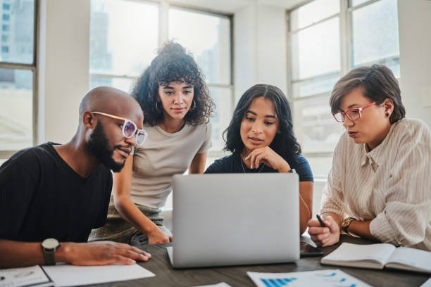 Creative startup and team webinar on laptop for professional internet communication in office. Web design 
and diverse company people in business video conference with wifi connection.